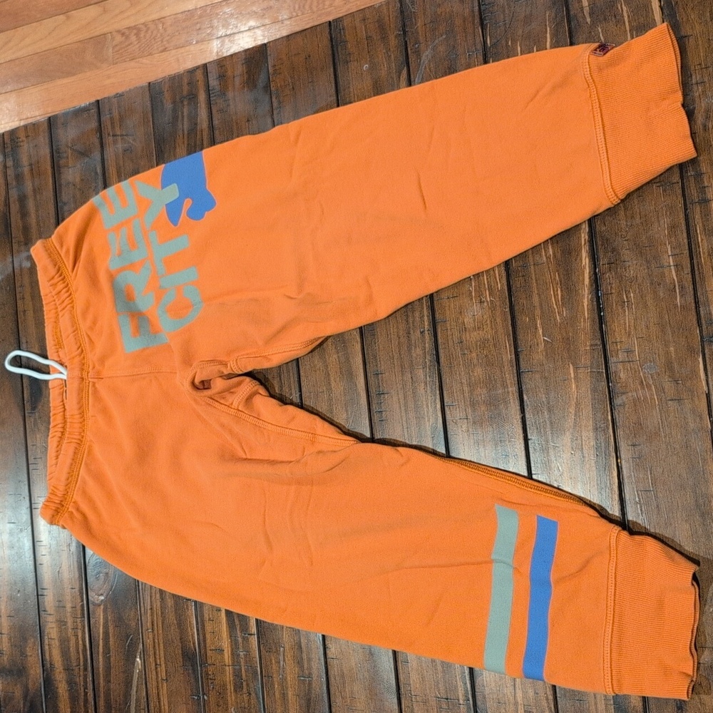 Freecity Vibrant Orange Joggers with Blue and Gray Details